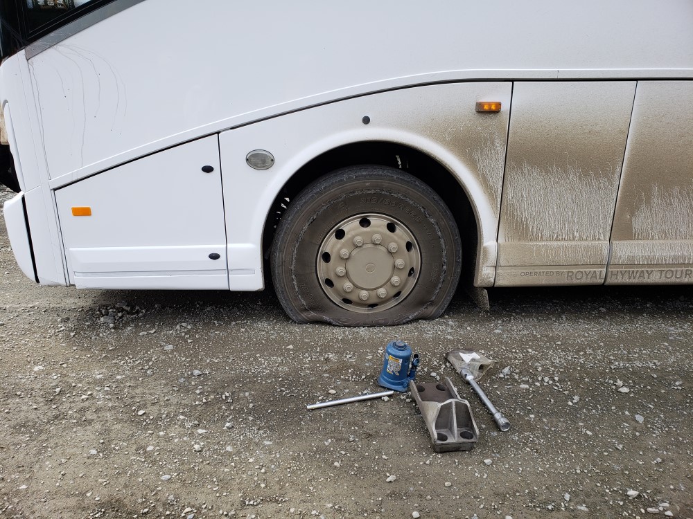 Bus Flat Tire in the Wilderness