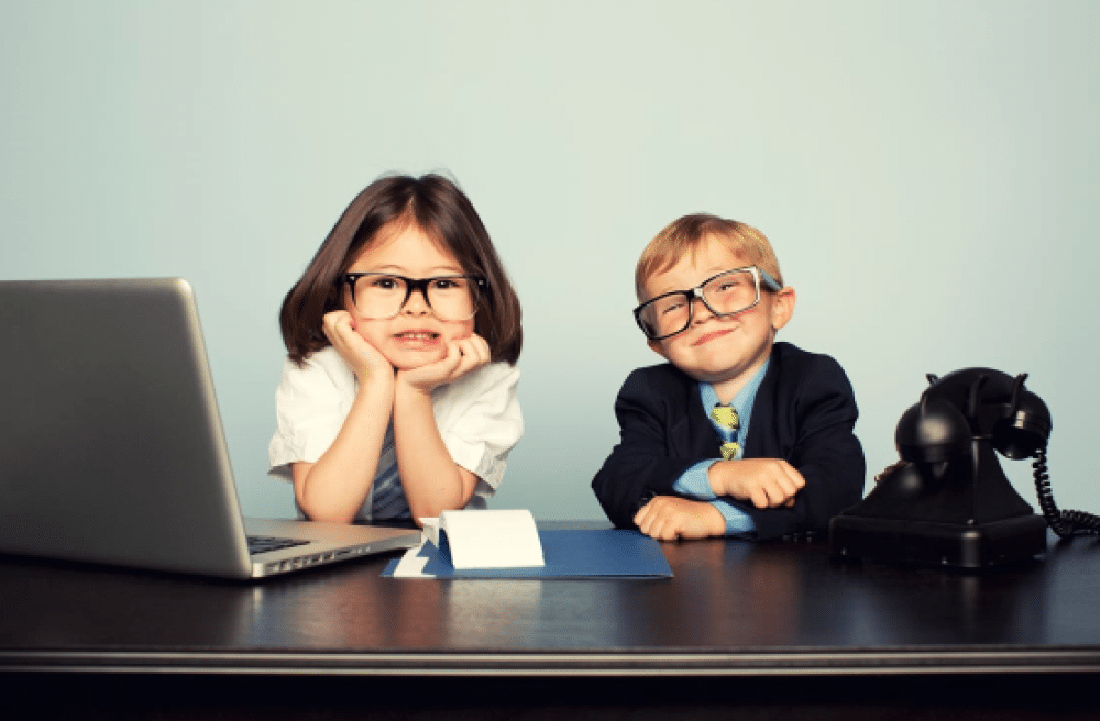 Boy & Girl behind Laptop and old fashion computer